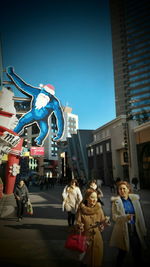 Woman standing in city