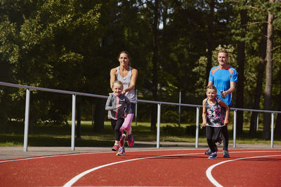 Family on running track