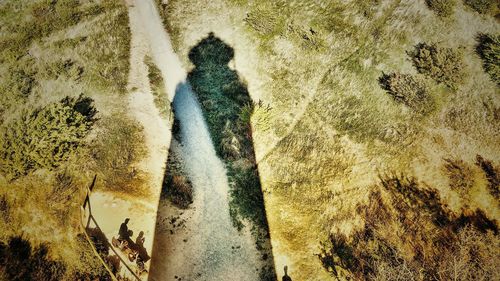 High angle view of people walking on beach