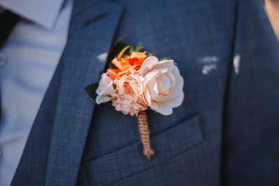 Close-up of person holding rose bouquet