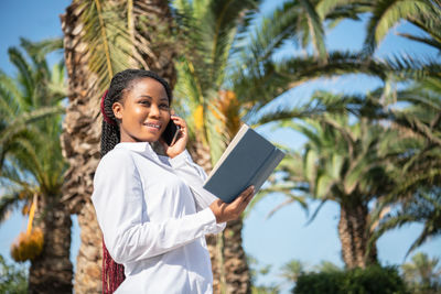 Young woman using digital tablet