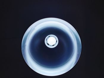 High angle view of light bulb against black background