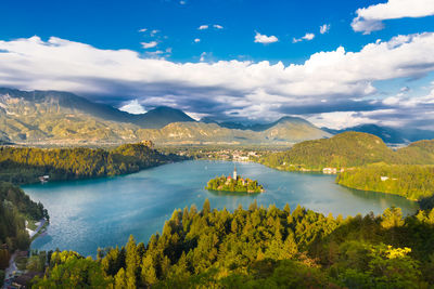 Scenic view of lake and mountains against sky