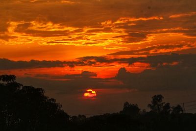 Scenic view of dramatic sky during sunset