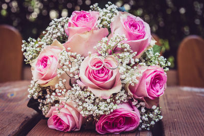 Close-up of pink roses on table