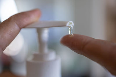 Close-up of person holding wineglass