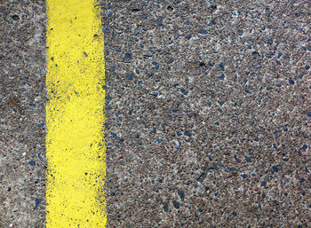 High angle view of yellow road on street