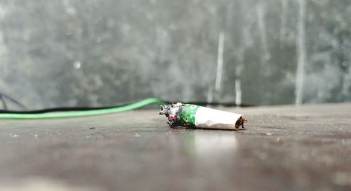 Close-up of cigarette smoking outdoors