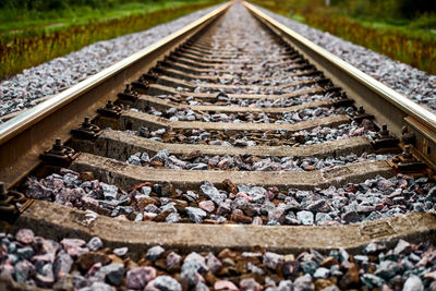 Railway track line going into distance, beautiful landscape. railroad in crushed stones, two rails