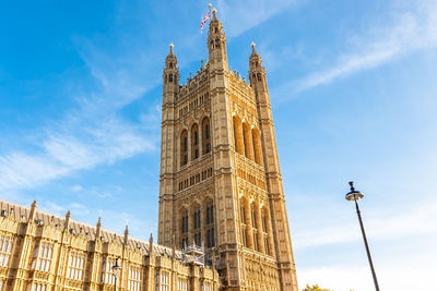 Low angle view of clock tower against sky