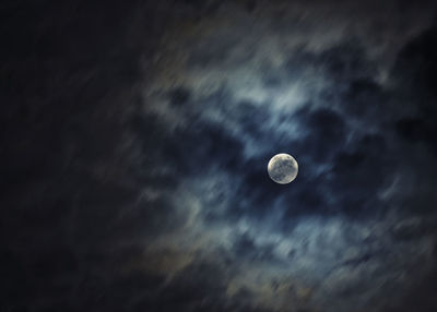 Low angle view of moon against the sky