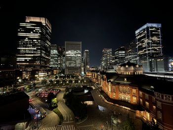 High angle view of illuminated buildings in city at night