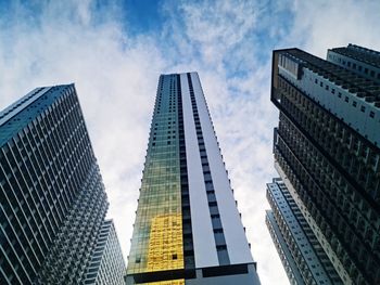 Low angle view of modern buildings against sky in city