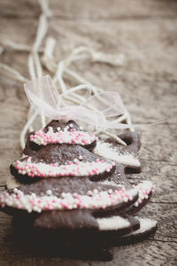 Close-up of chocolate christmas tree cookies on wooden table