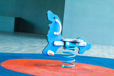 Blue toy car in swimming pool