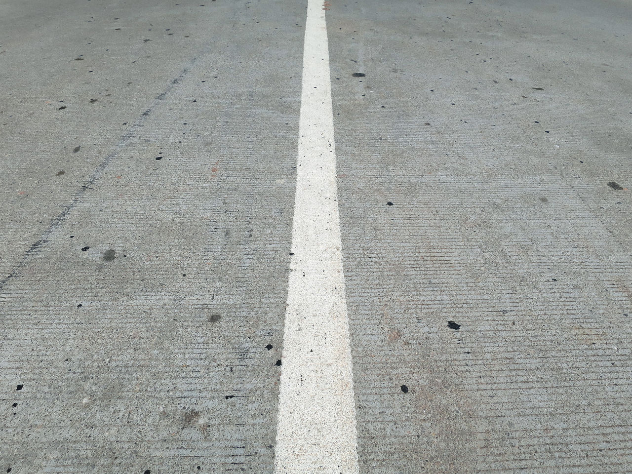 HIGH ANGLE VIEW OF ROAD MARKING