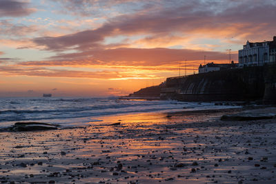 Scenic view of sea at sunset