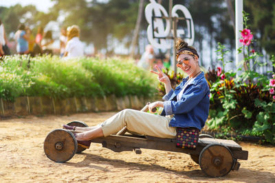 Portrait of smiling man sitting outdoors