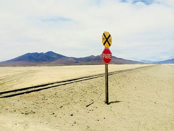 Road sign against clear sky