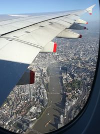 Aerial view of city seen through airplane window