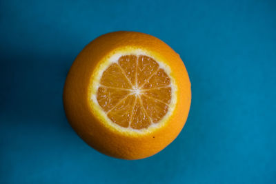 Close-up of orange against blue background