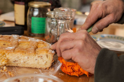 Close-up of man preparing food