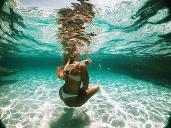 Woman swimming in pool