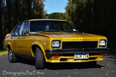 Yellow car against sky