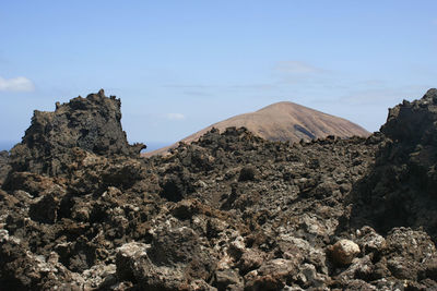 Scenic view of rocky mountains against sky
