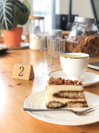 Close-up of cake and coffee on table