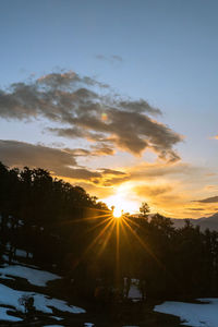 Scenic view of sunset against sky during winter