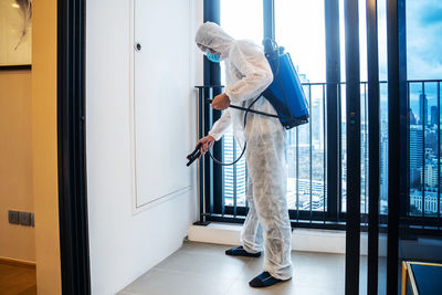 Man working on door at home