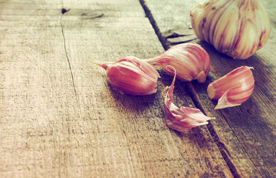 Close-up of garlic on wooden table