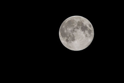 Low angle view of moon against sky at night