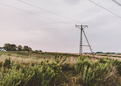 Electricity pylon on field