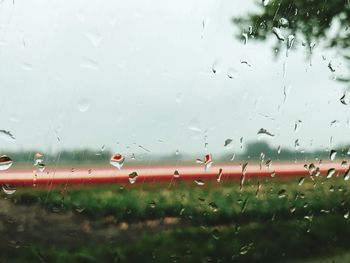 Close-up of wet window during rainy season