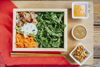 Overhead view of food served on table in commercial kitchen