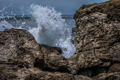 Waves breaking on rocks