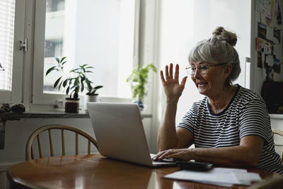 Senior woman using laptop