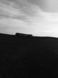 Scenic view of farm against sky