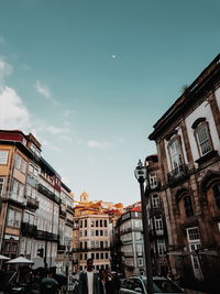 Low angle view of buildings in city against sky