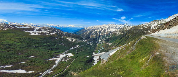 High angle view of snowcapped mountains against sky