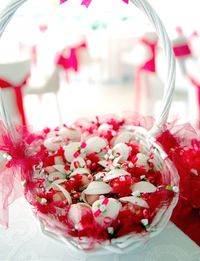 Close-up of pink flowers in jar on table