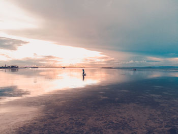 Scenic view of sea against sky at sunset