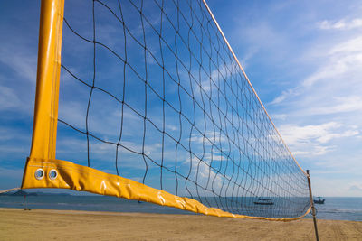 Beach volleyball net on beach