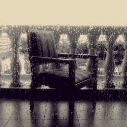 View of cityscape through wet glass