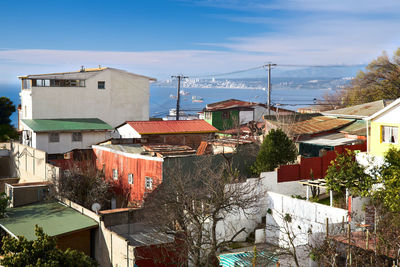 High angle view of buildings in town against sky