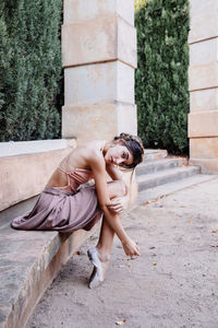 Young professional ballerina posing outdoors