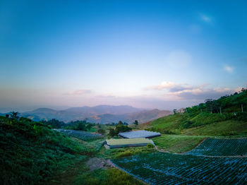 Scenic view of landscape against sky during sunset