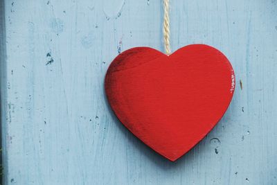 Close-up of red heart shape wood